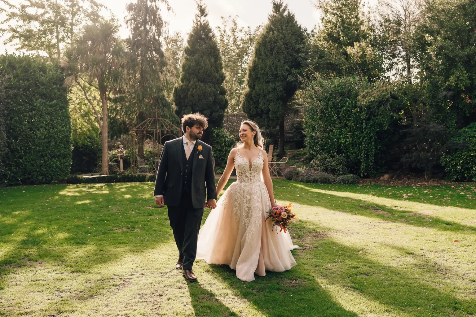 Bride and groom in Pelham House gardens in autumn